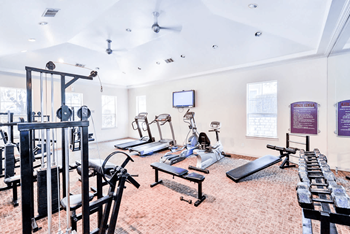 24/7 Fitness center with strength training & cardio equipment